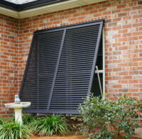 Bahama shutters installed on a Gulf Coast home